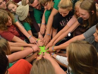 Teens taking part in team building activities